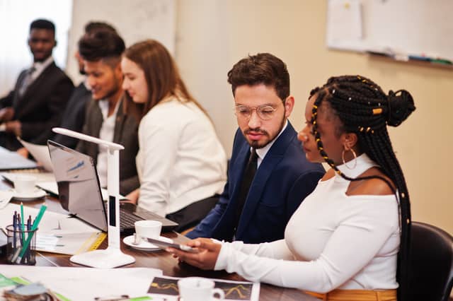 young creative people in office discussing